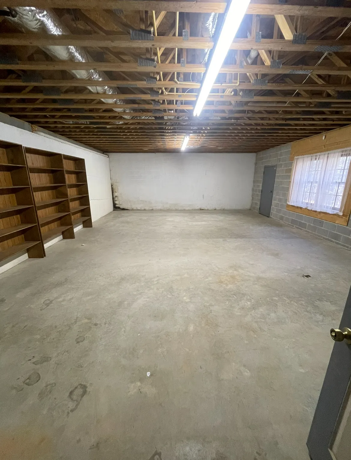 Basement swept and cleaned after professional junk removal